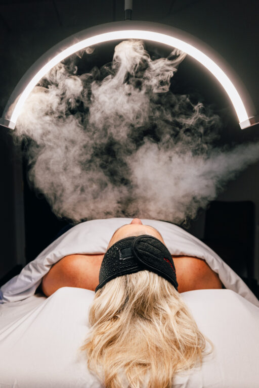 A patient relaxes as she receives a chemical peel for bacne in Overland Park. Each peel will be tailored to each patient's specific needs to ensure a safe and effective treatment.