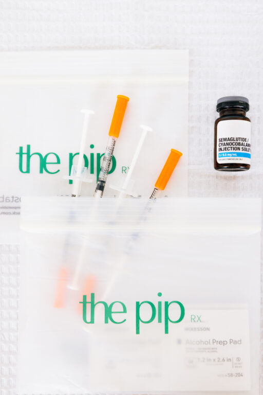 Medical weight loss medication prepared for a client at The Pip Rx, packaged in a branded biodegradable bag as part of a personalized GLP-1 treatment plan in Overland Park, Kansas.
